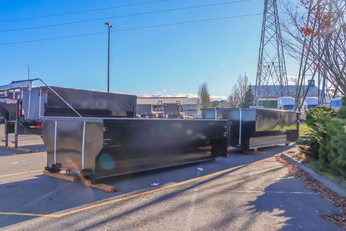 Roll-off dumpster ready for waste disposal at job site for 2 Yard Dumpster Rental in Moss Point
